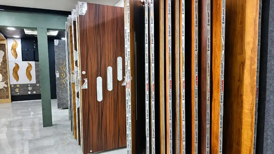 Wood-grain membrane doors with marble-pattern inlays on the showroom display rack