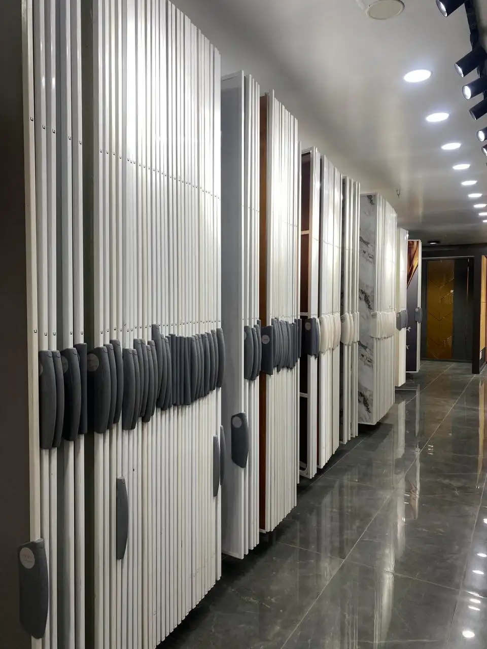 Rows of laminate sheets in pull-out display racks at the showroom